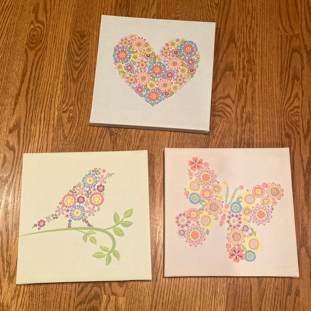 Three canvas wall hangings